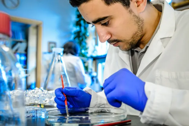 Photo of researcher at the lab bench